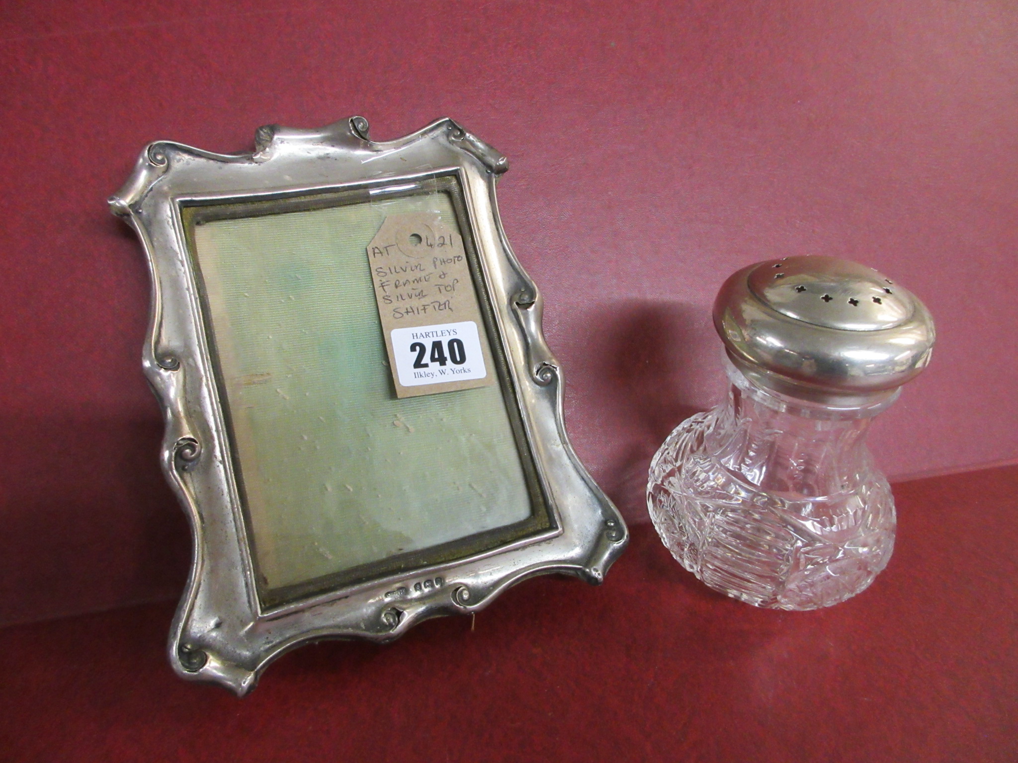 SILVER PHOTO FRAME AND A SILVER TOPPED SIFTER Image