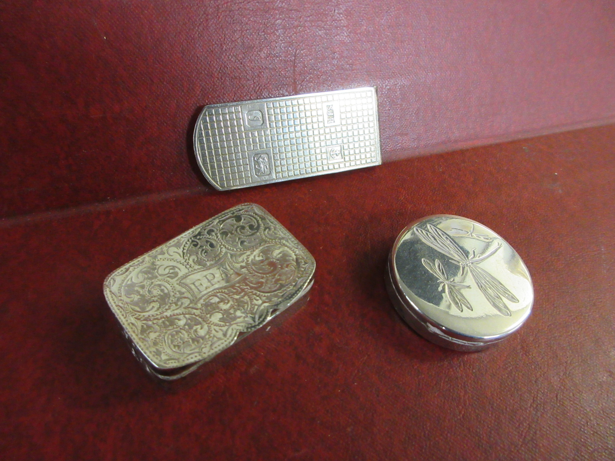 TWO SMALL SILVER BOXES AND A MONEY CLIP Image