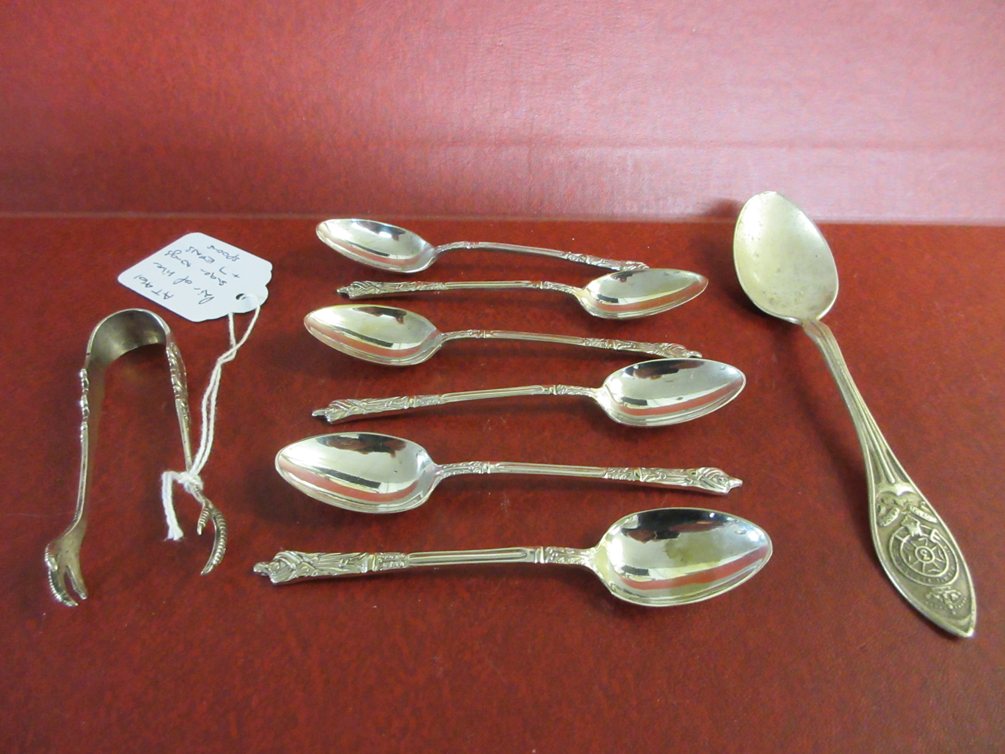 PAIR OF SILVER SUGAR TONGS AND SEVEN EPNS SPOONS Image