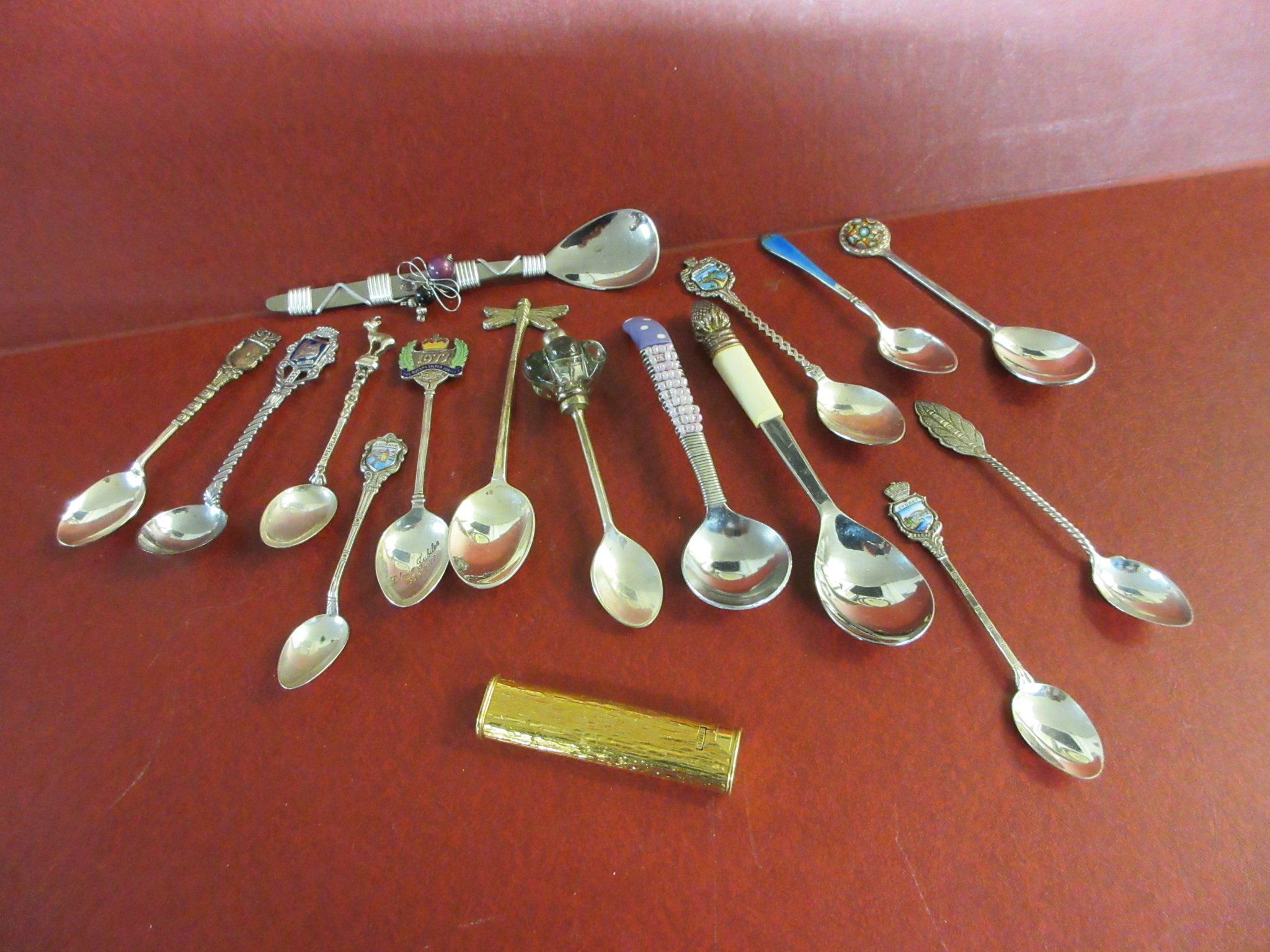 BOX OF SILVER AND OTHER SPOONS AND A LIGHTER Image