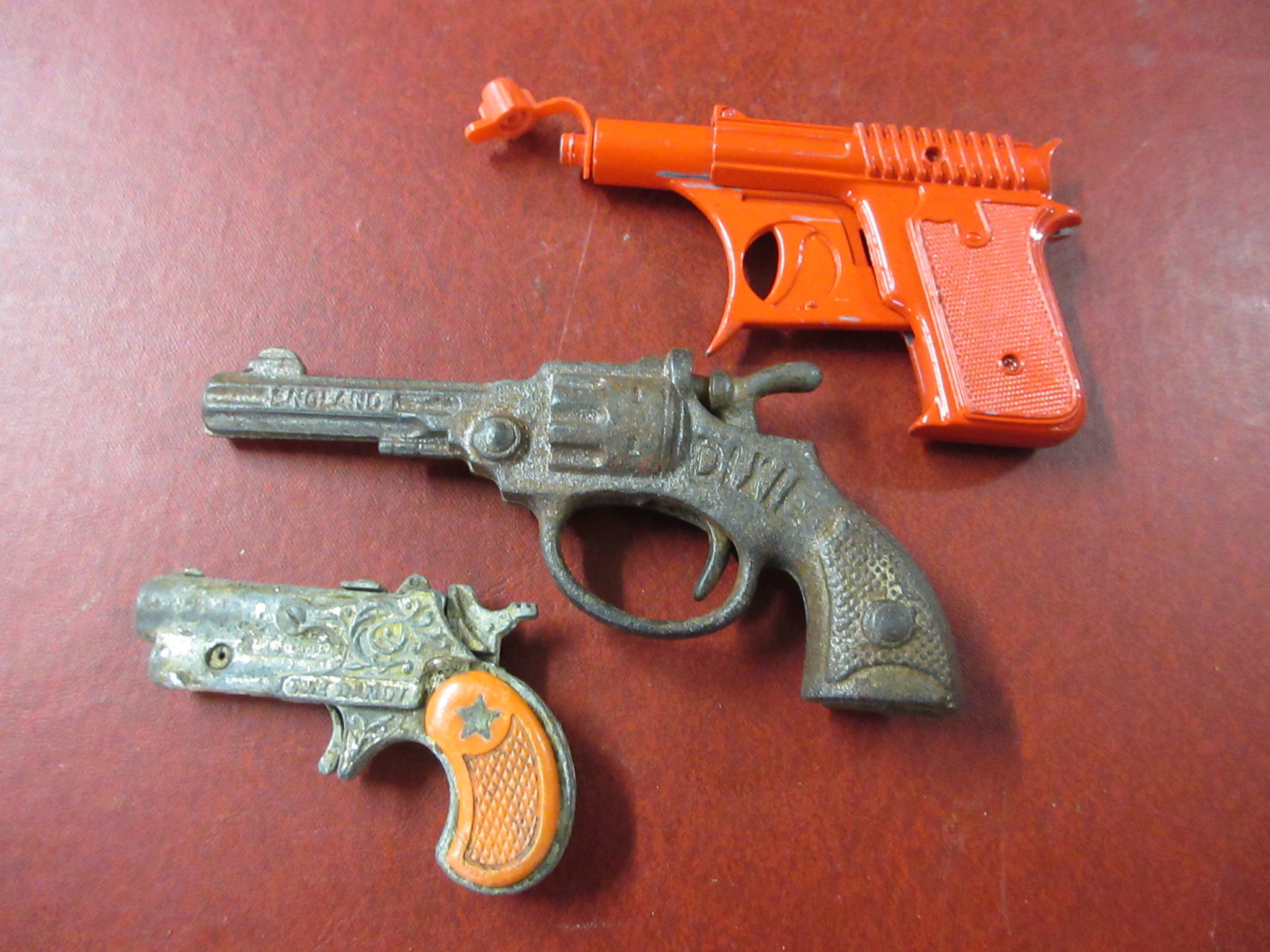 THREE VINTAGE TOY CAP GUNS Image