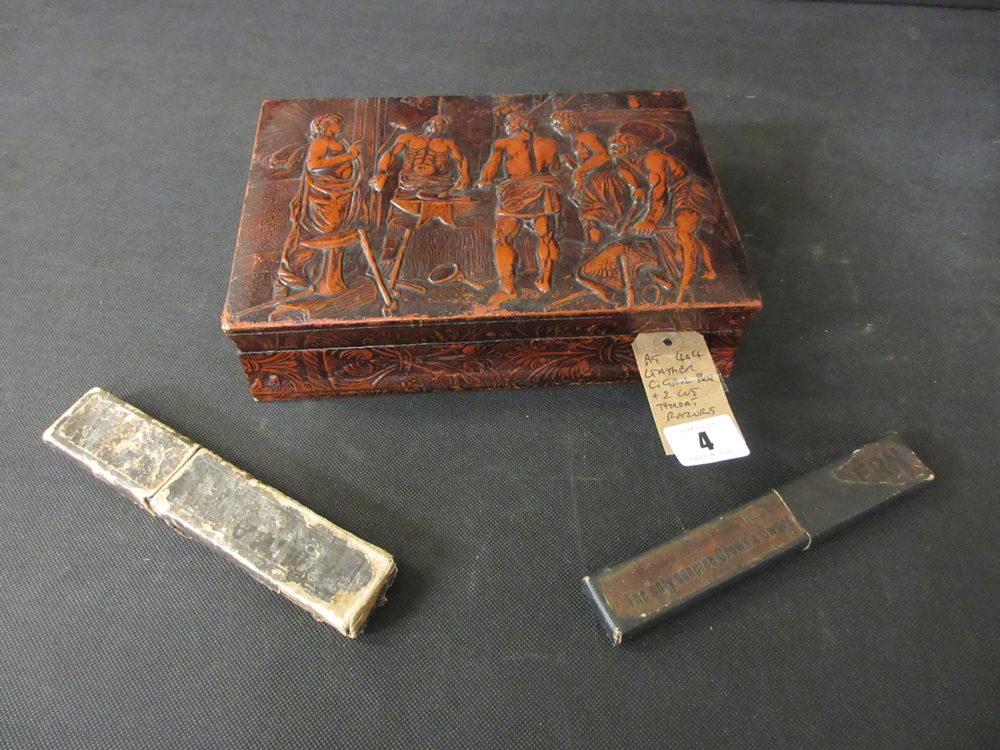 LEATHER CIGAR BOX AND TWO CUT THROAT RAZORS Image