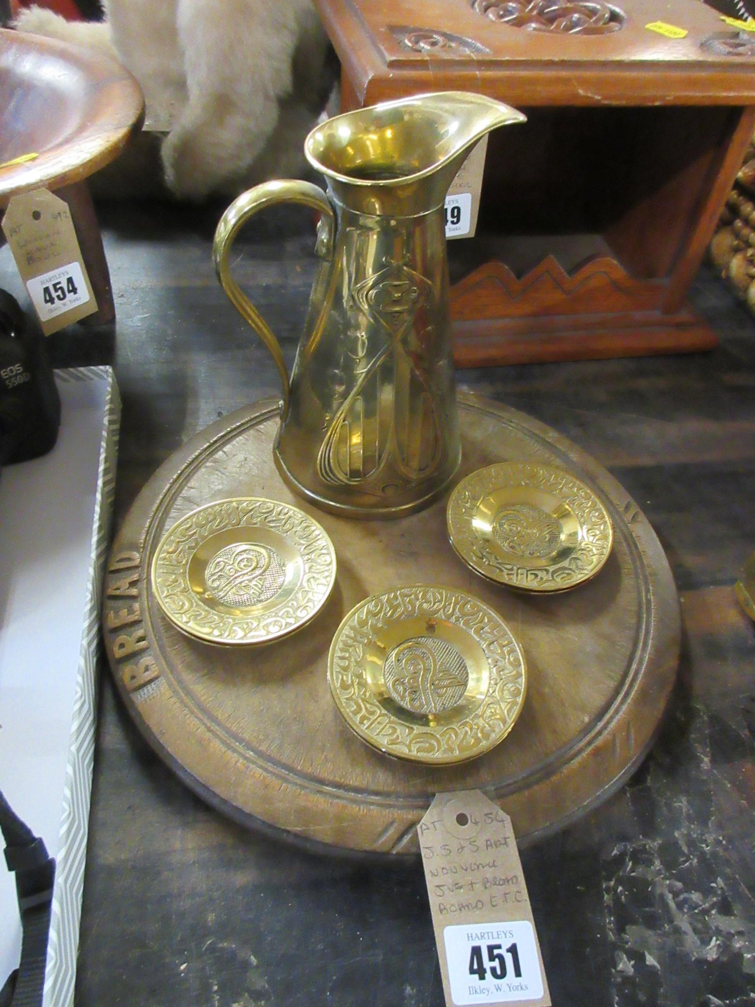 JS & S ART NOUVEAU BRASS JUG BREADBOARD AND SIX BRASS DISHES Image