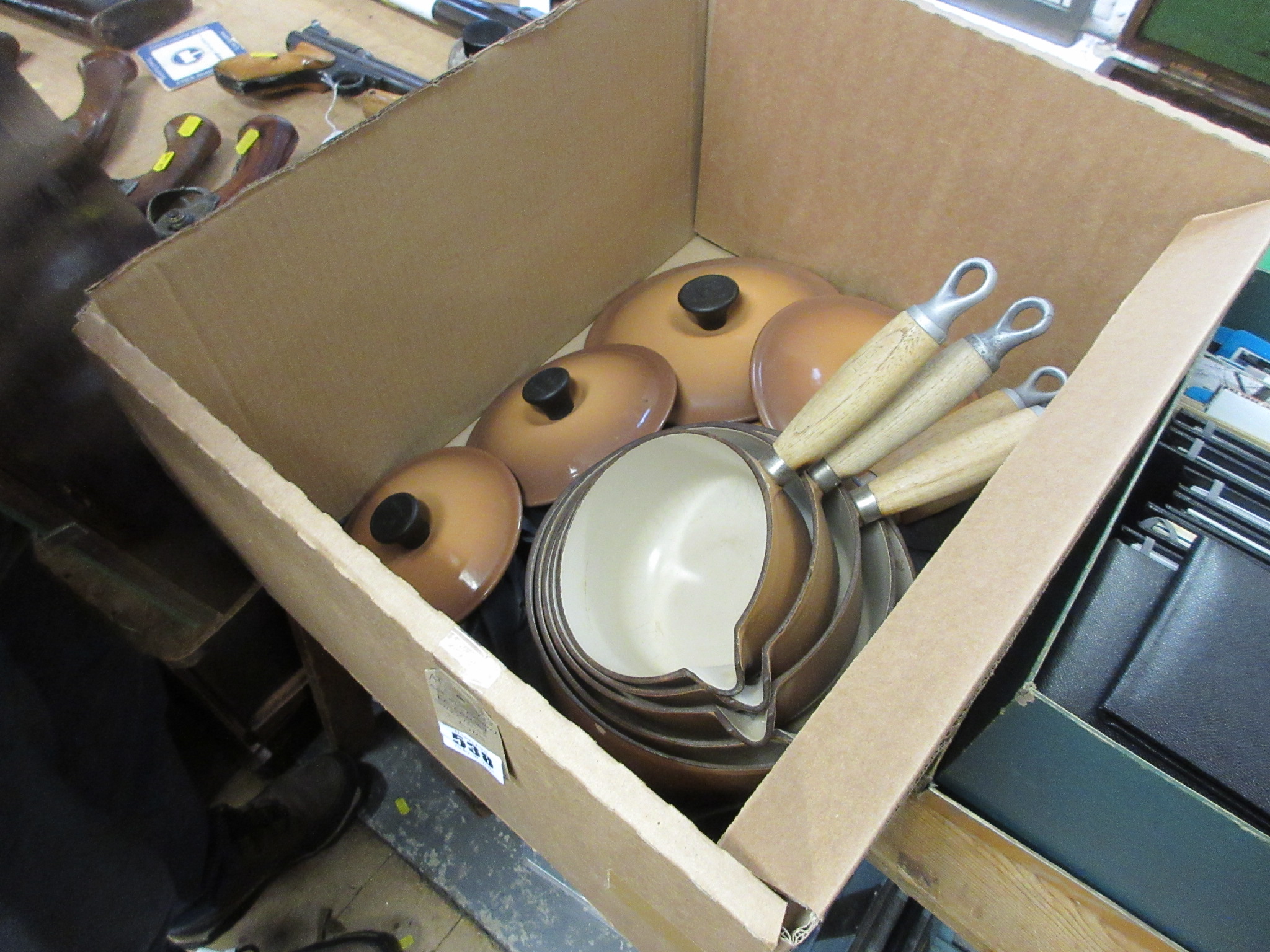 SET OF BROWN LE CREUSET SAUCEPANS WITH LIDS Image