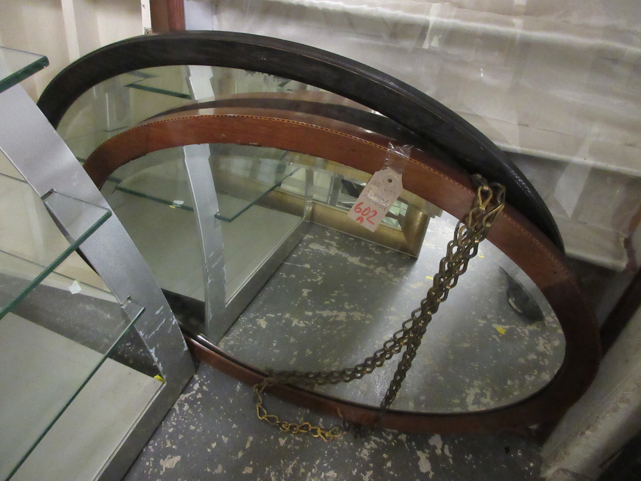 TWO OVAL MIRRORS Image