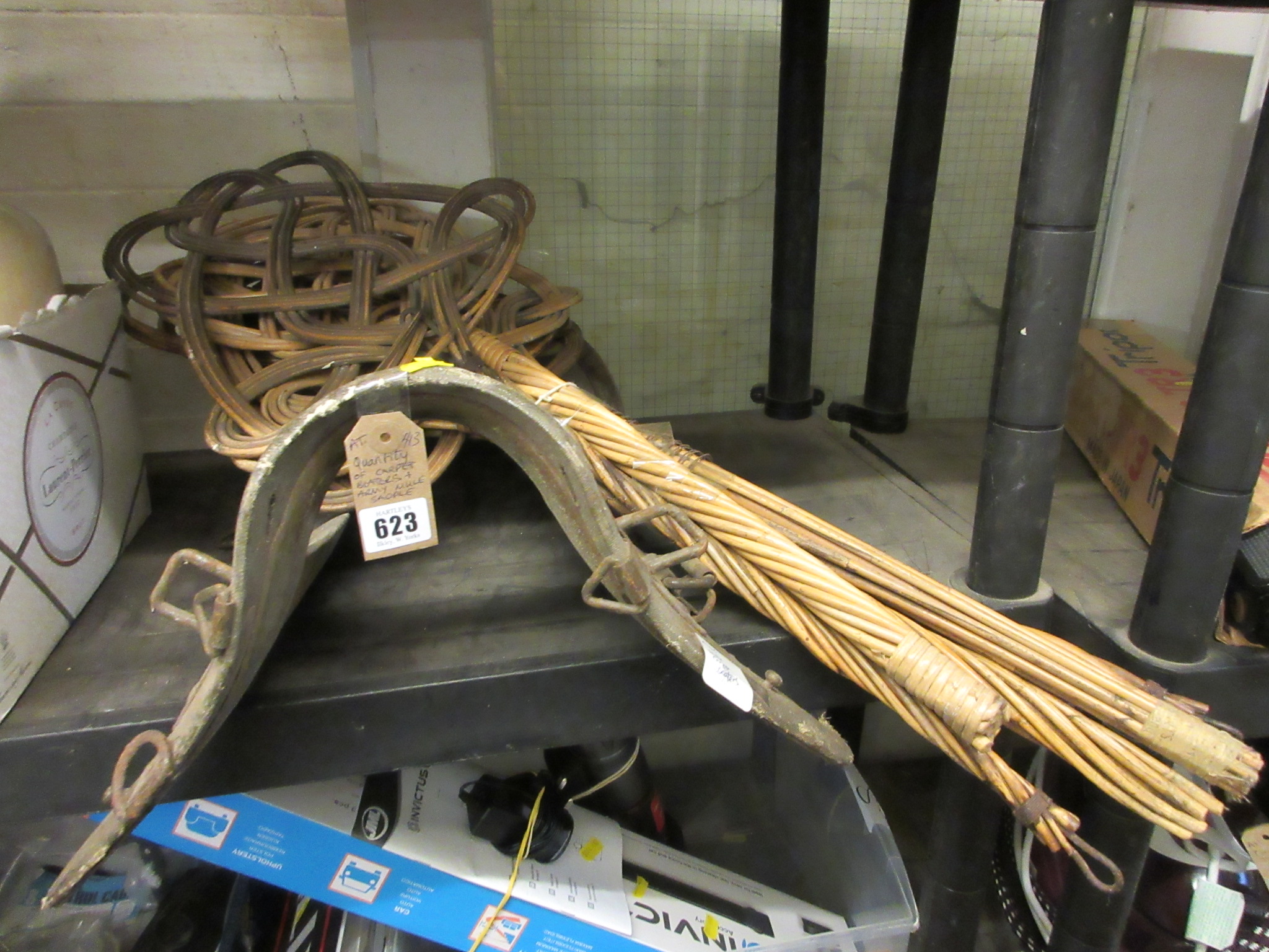 QUANTITY OF CARPET BEATERS AND AN ARMY MULE SADDLE Image