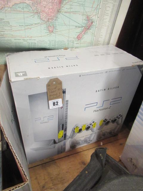 BOXED SILVER PS2 WITH GAMES AND CONTROLS Image