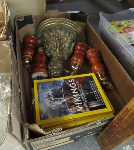 FOUR SOFA LEGS  GILDED SCONCE AND MAGAZINES Image