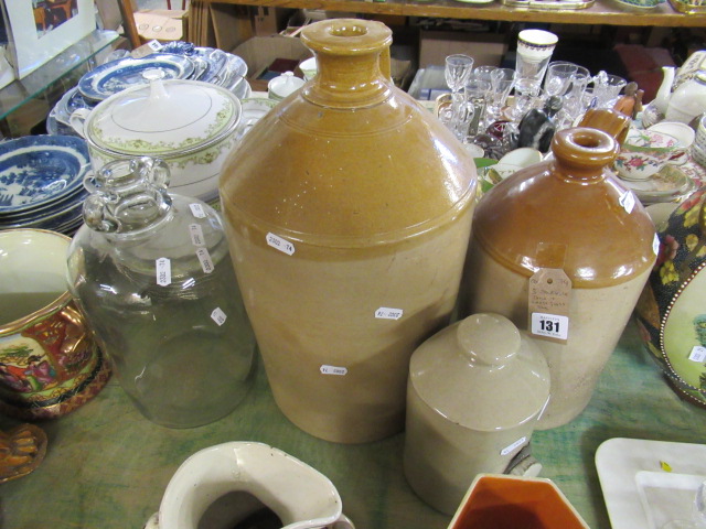 THREE STONEWARE FLAGONS AND A GLASS FLAGON Image