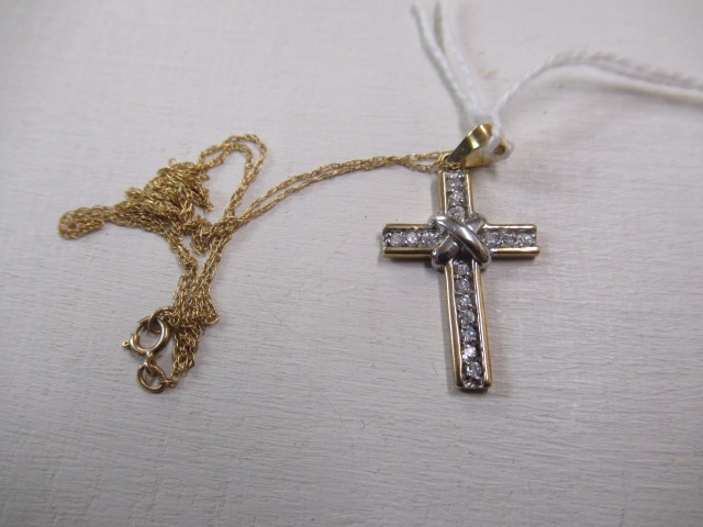 9CT GOLD AND CZ CROSS AND A 9CT GOLD CHAIN Image