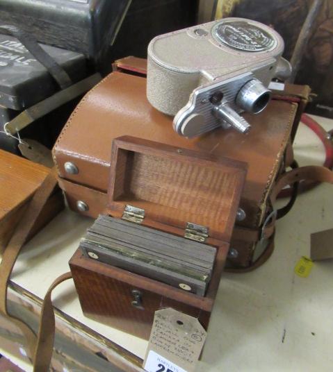 BELL AND HOWELL CINE CAMERA IN LEATHER CASE AND A BOX OF MAGIC LANTERN SLIDES Image