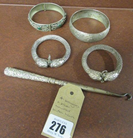 FOUR BANGLES AND SILVER BUTTON HOOK Image