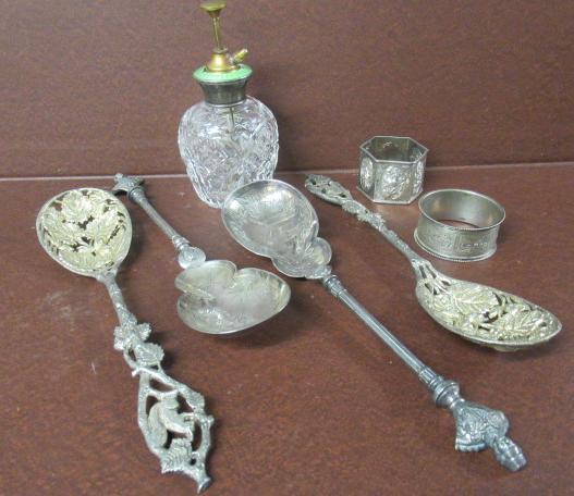 QUANTITY OF SPOONS  NAPKIN RINGS AND A PERFUME BOTTLE ETC Image