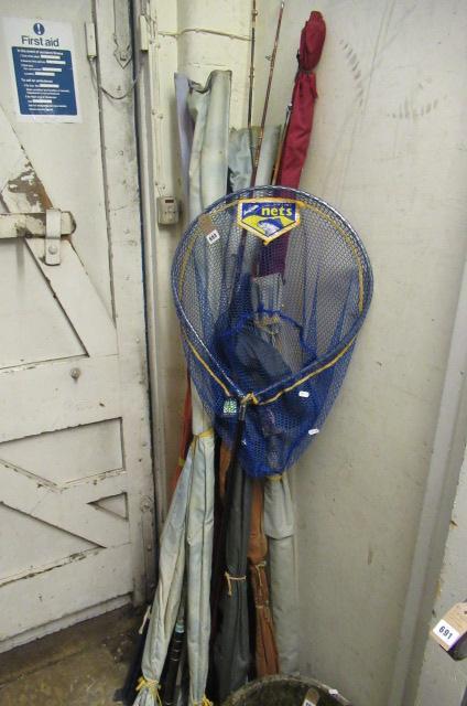 LARGE QUANTITY OF FISHING RODS AND A LANDING NET Image