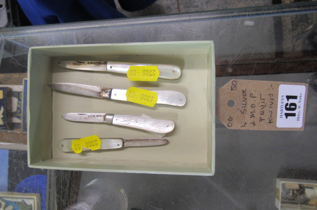 FOUR SILVER AND MOTHER OF PEARL FRUIT KNIVES Image
