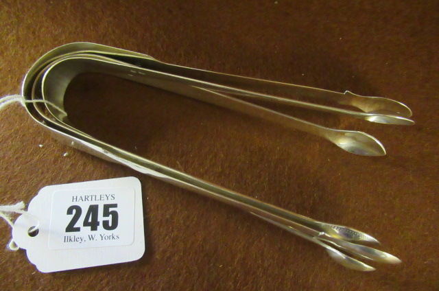 THREE PAIRS OF SILVER SUGAR TONGS Image