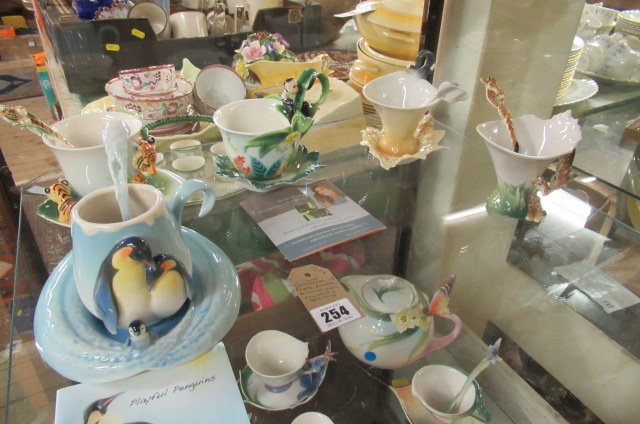 COLLECTION OF FRANZ PORCELAIN ANIMAL CUPS  SAUCERS AND SPOONS Image