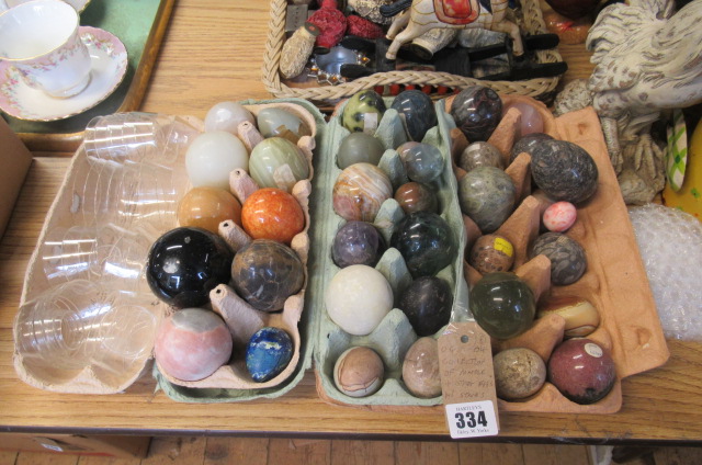 COLLECTION OF MARBLE AND OTHER EGGS AND STANDS Image