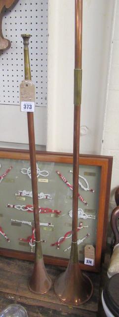 TWO BRASS AND COPPER HUNTING HORNS Image