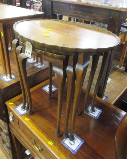 WALNUT NEST OF THREE TABLES Image