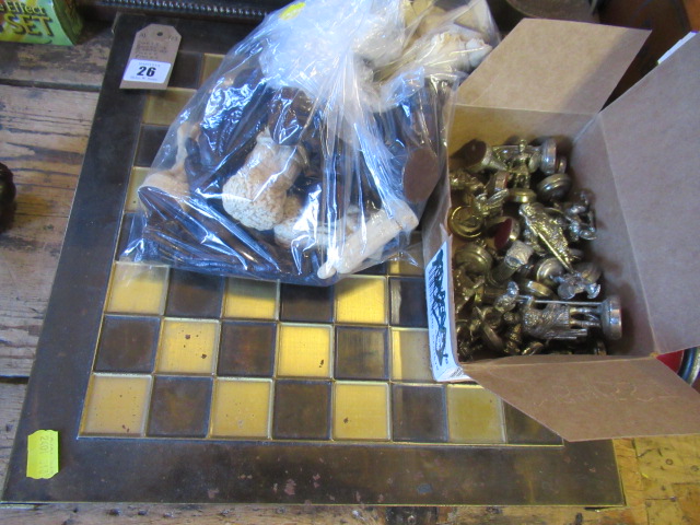 CHESS BOARD AND TWO SETS OF CHESS PIECES Image