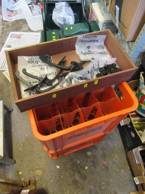 TWO BOTTLE CRATES AND A BOX OF WROUGHT IRON HANDLES Image
