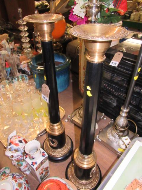 PAIR OF BLACK AND GILT CANDLESTICKS Image