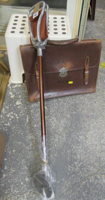 LEATHER BRIEFCASE AND SHOOTING STICK Image