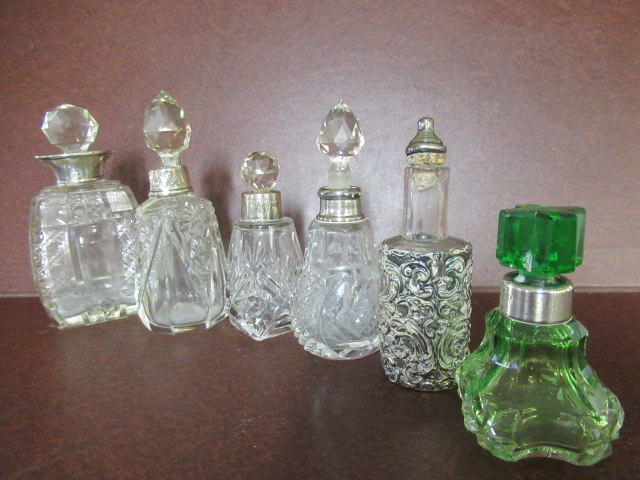 SIX SILVER COLLARED BOTTLES Image