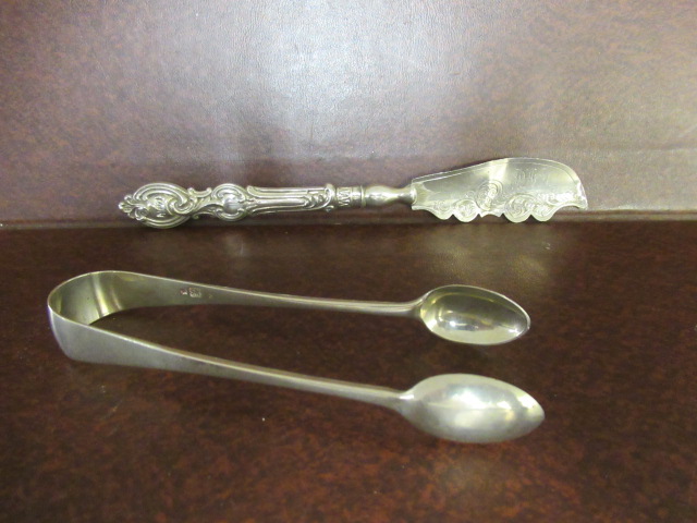 SILVER TONGS AND SILVER BUTTER KNIFE Image