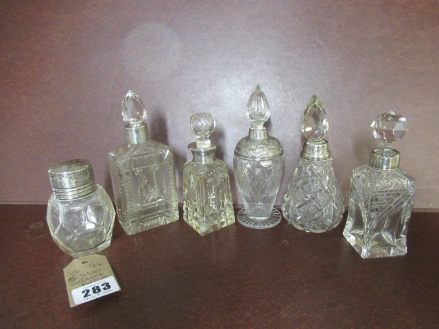SIX SILVER COLLARED BOTTLES Image