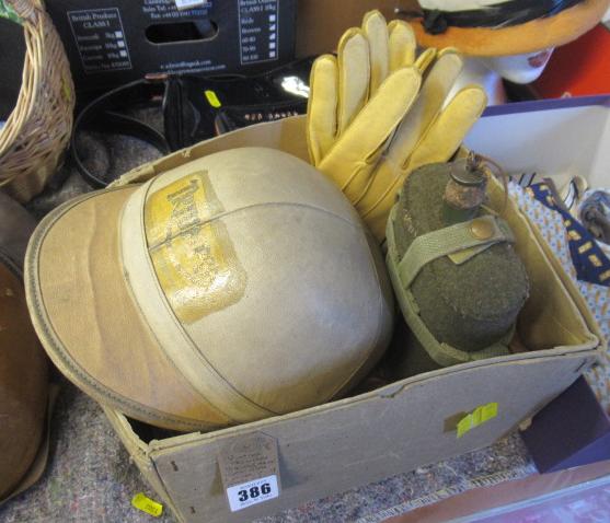 VINTAGE TRIUMPH SKULGARDE MOTORCYCLE HELMET WITH A PAIR OF GLOVES AND A FLASK Image