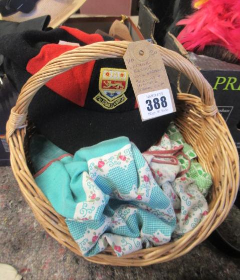 WICKER BASKET WITH APRONS  SCARVES AND A VINTAGE SCHOOL CAP Image