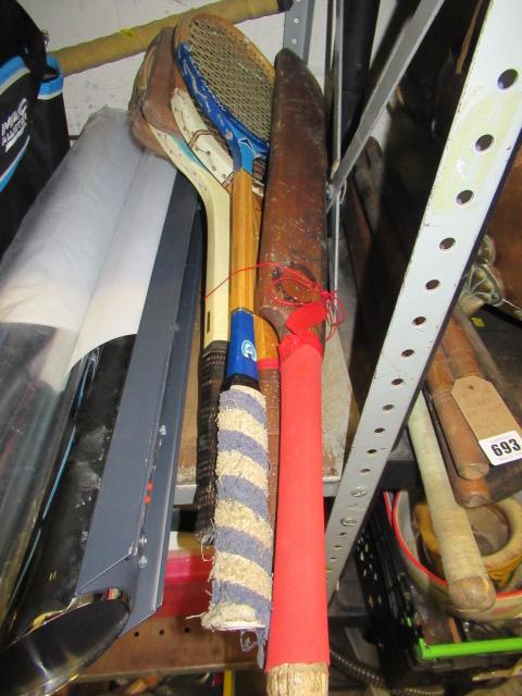 THREE RACKETS AND A CRICKET BAT  Image