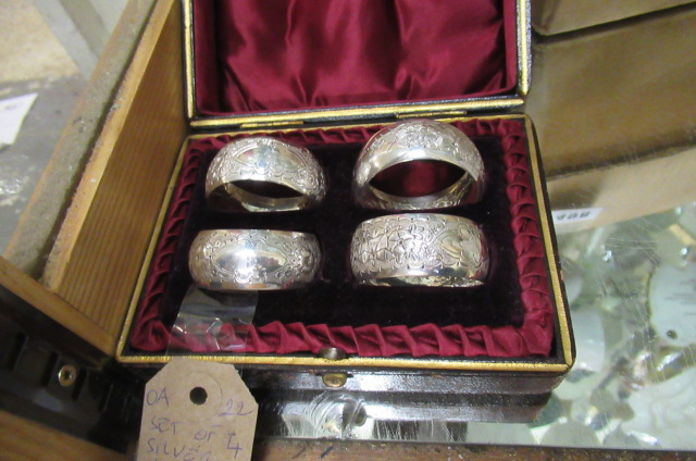 SET OF FOUR SILVER NAPKIN RINGS Image