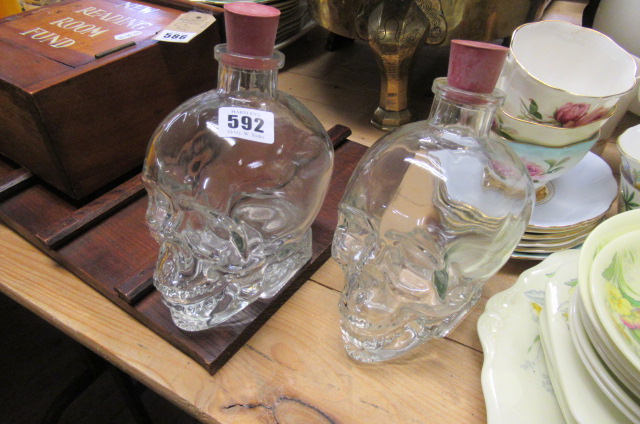 TWO GLASS SKULL DECANTERS Image