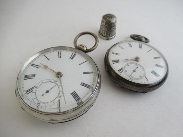 TWO SILVER POCKET WATCHES AND A THIMBLE Image