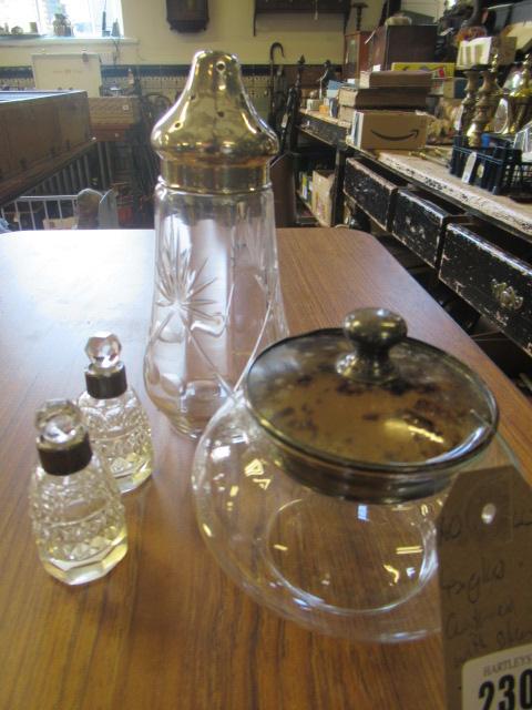 SILVER TOPPED SUGAR CASTOR PAIR OF PERFUME BOTTLES AND A POWDER JAR Image