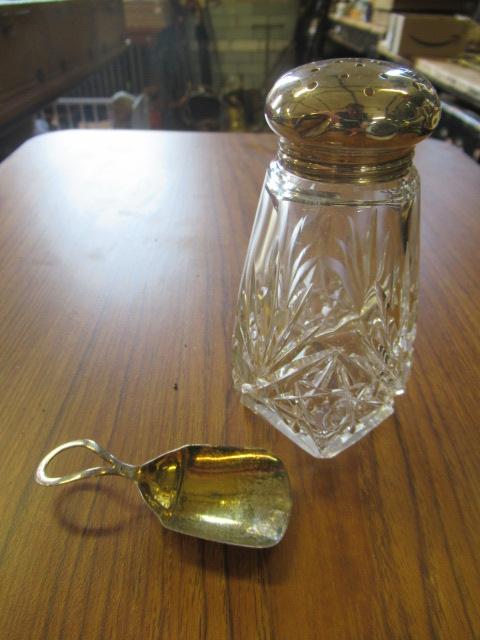 GEORGIAN SILVER CADDY SPOON AND A SILVER TOPPED SUGAR SIFTER Image