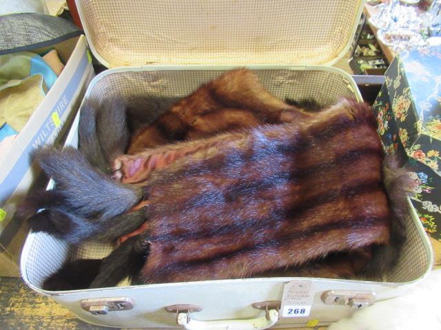 SUITCASE WITH FUR STOLES Image