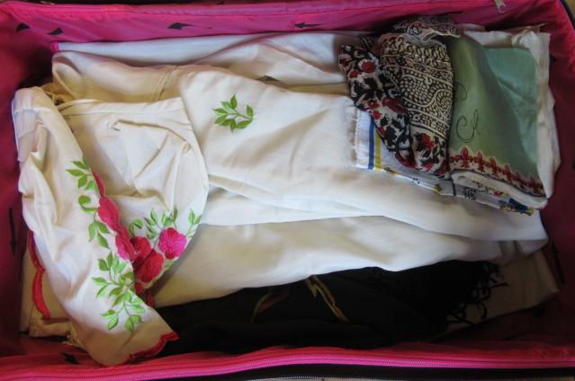 SUITCASE OF TEXTILES SCARVES AND A DRESS Image