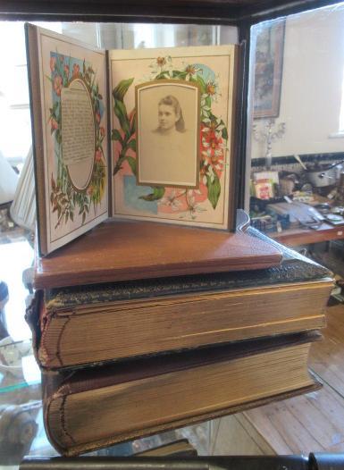 TWO VICTORIAN PHOTO ALBUMS AND TWO FOLDING LEATHER FRAMES Image