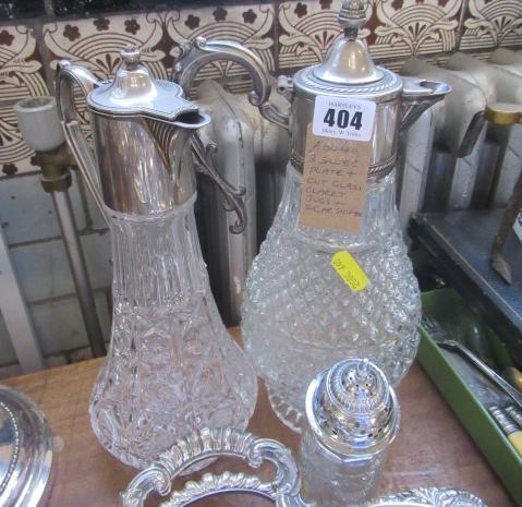 TWO EPNS MOUNTED CLARET JUGS AND A SUGAR SIFTER Image