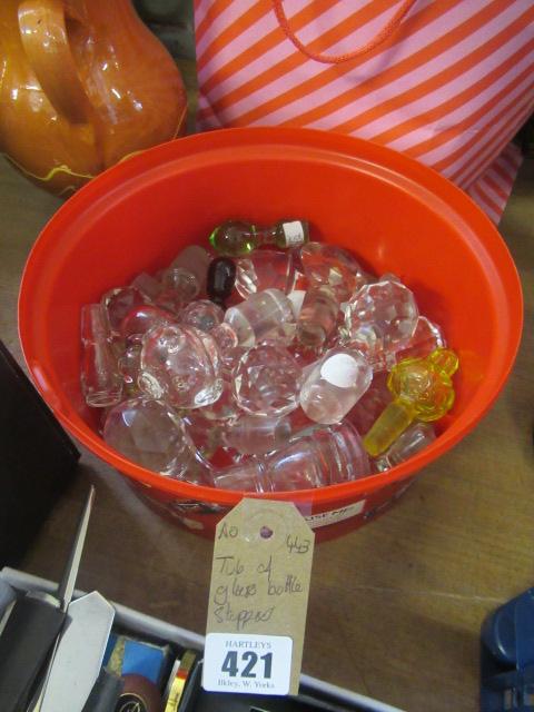 TUB OF GLASS BOTTLE STOPPERS Image