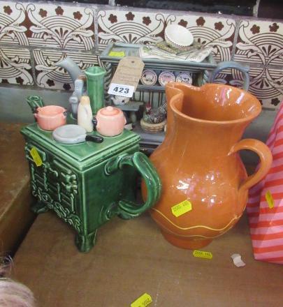 TWO CHARACTER TEAPOTS AND A TERRACOTTA JUG Image
