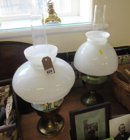 TWO OIL LAMPS WITH MILK GLASS SHADES Image