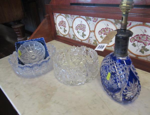 BLUE OVERLAY GLASS LAMP BASE AND THREE CUT GLASS BOWLS Image