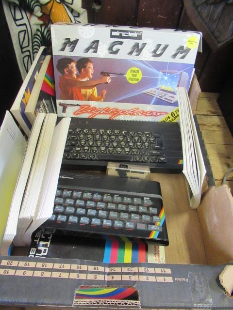 TWO SINCLAIR ZX SPECTRUM COMPUTERS WITH BOXED LIGHT PHASER GAMES AND RELEVANT BOOKS Image