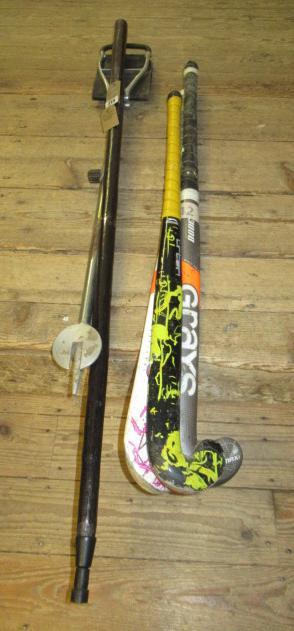 SHOOTING STICK A WALKING STAFF AND THREE HOCKEY STICKS Image