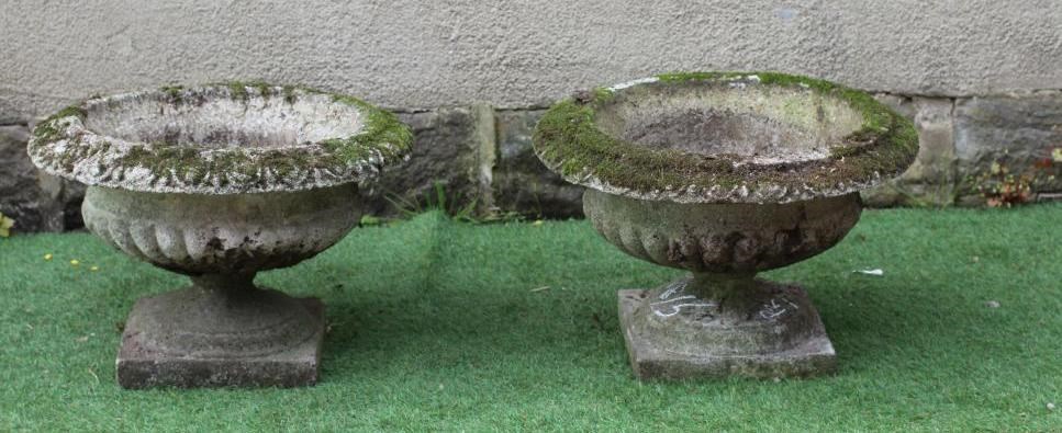 PAIR OF COMPOSITE GARDENS URNS, the shallow half fluted bowl with ovolo moulded rim, moulded socle Image